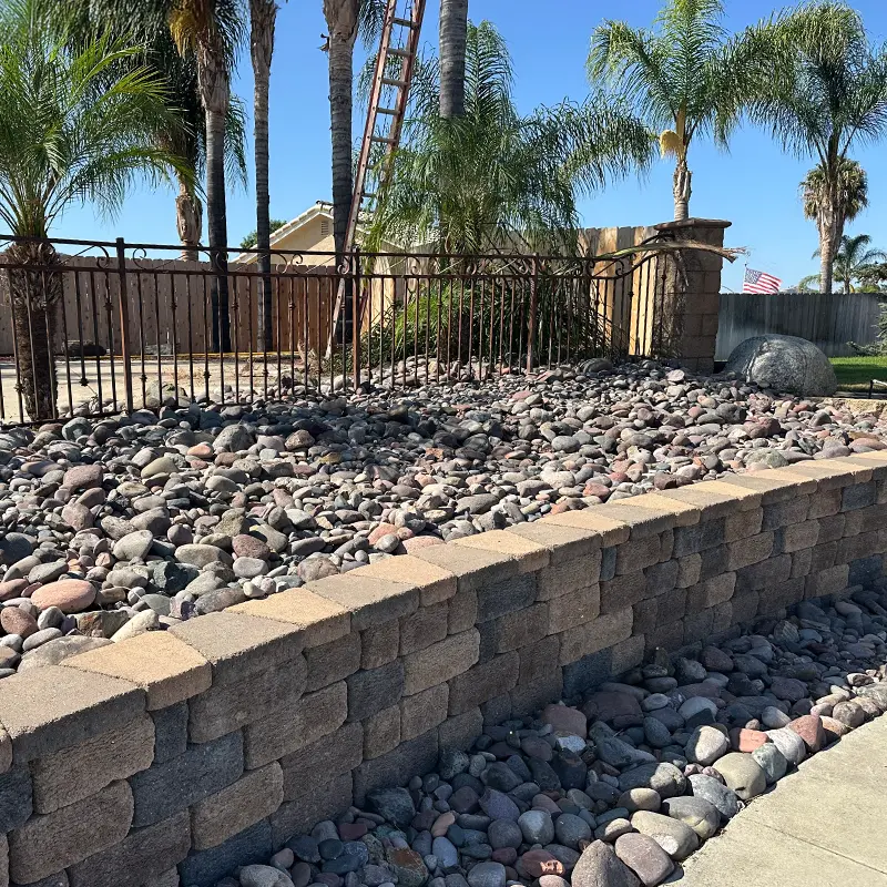 decorative rock landscape with retaining wall installed by Ultra Landscaping in East County San Diego